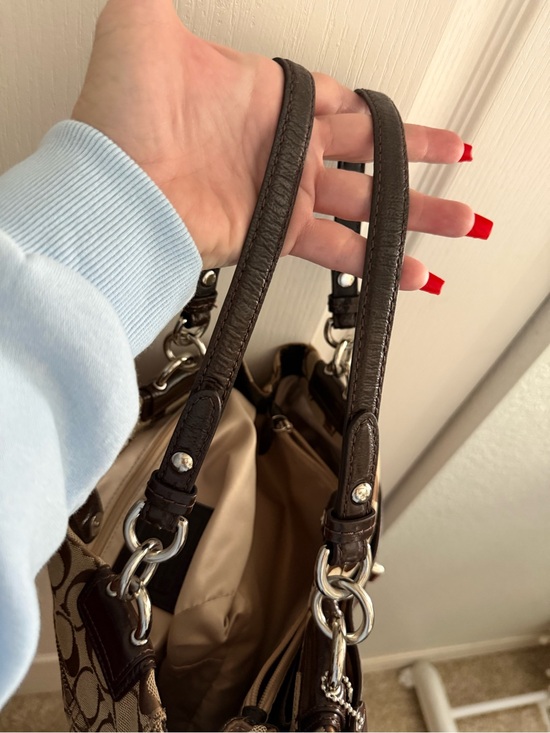 Coach Signature Canvas Shoulder Bag in Brown. Matching Coach wallet main image 1